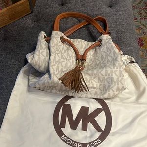Cream colored monogram Michael Kors shoulder bag